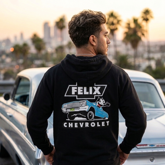 Person wearing black 1964 Impala Metal Flake Hoodie – Blue with vintage Felix Chevrolet lowrider artwork