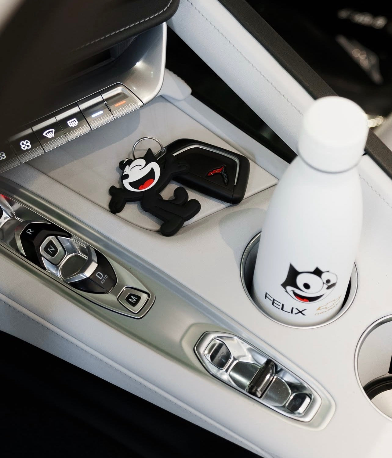 Felix Chevrolet Felix mascot PVC keychain on vehicle center console