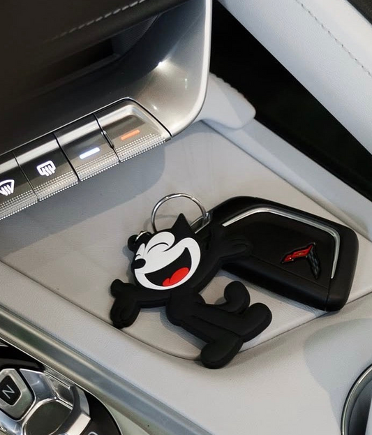 Felix Chevrolet mascot keychain attached to car keys inside vehicle
