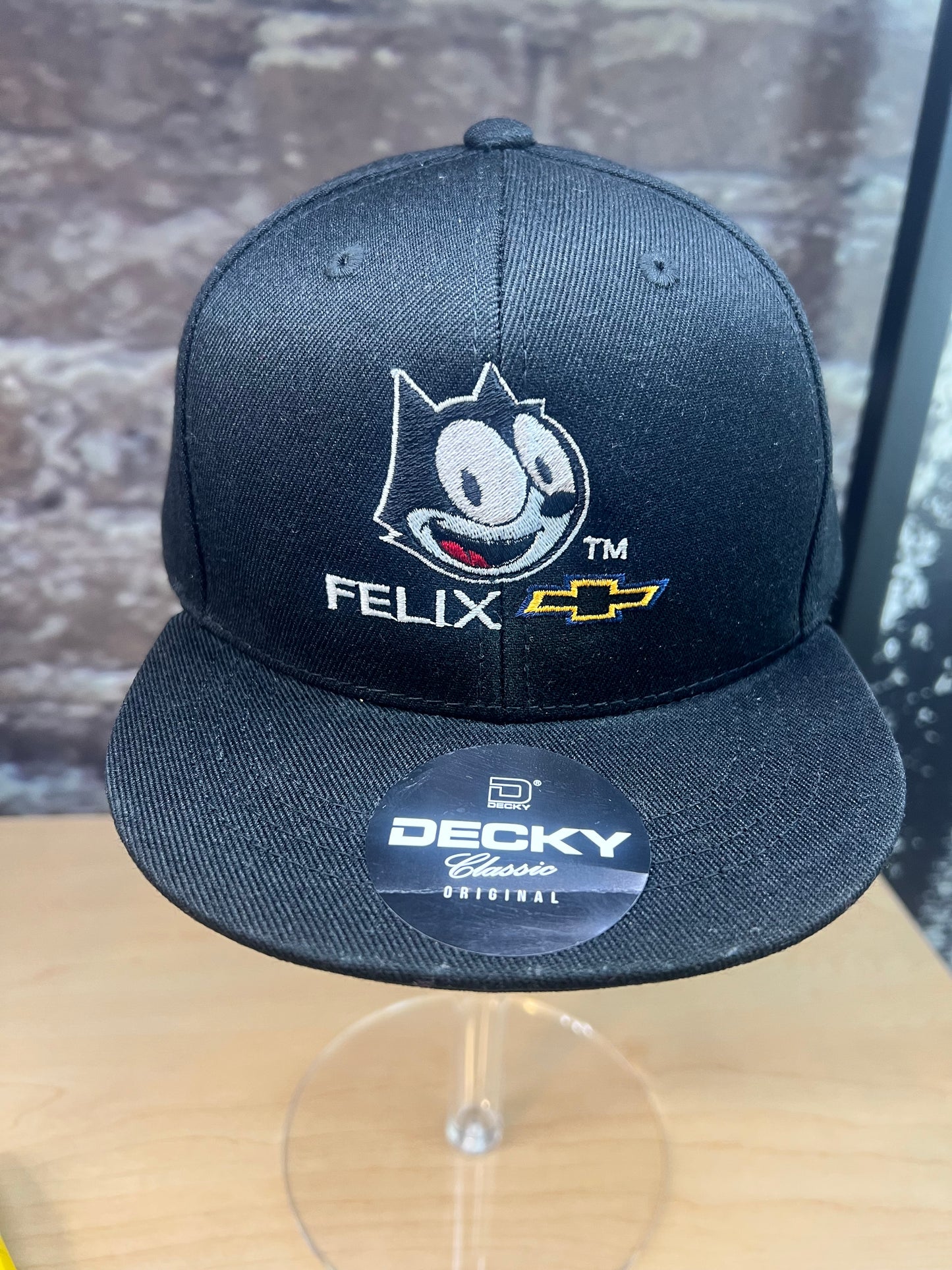 Black youth snapback hat with Felix the Cat and Chevy logo embroidered on the front