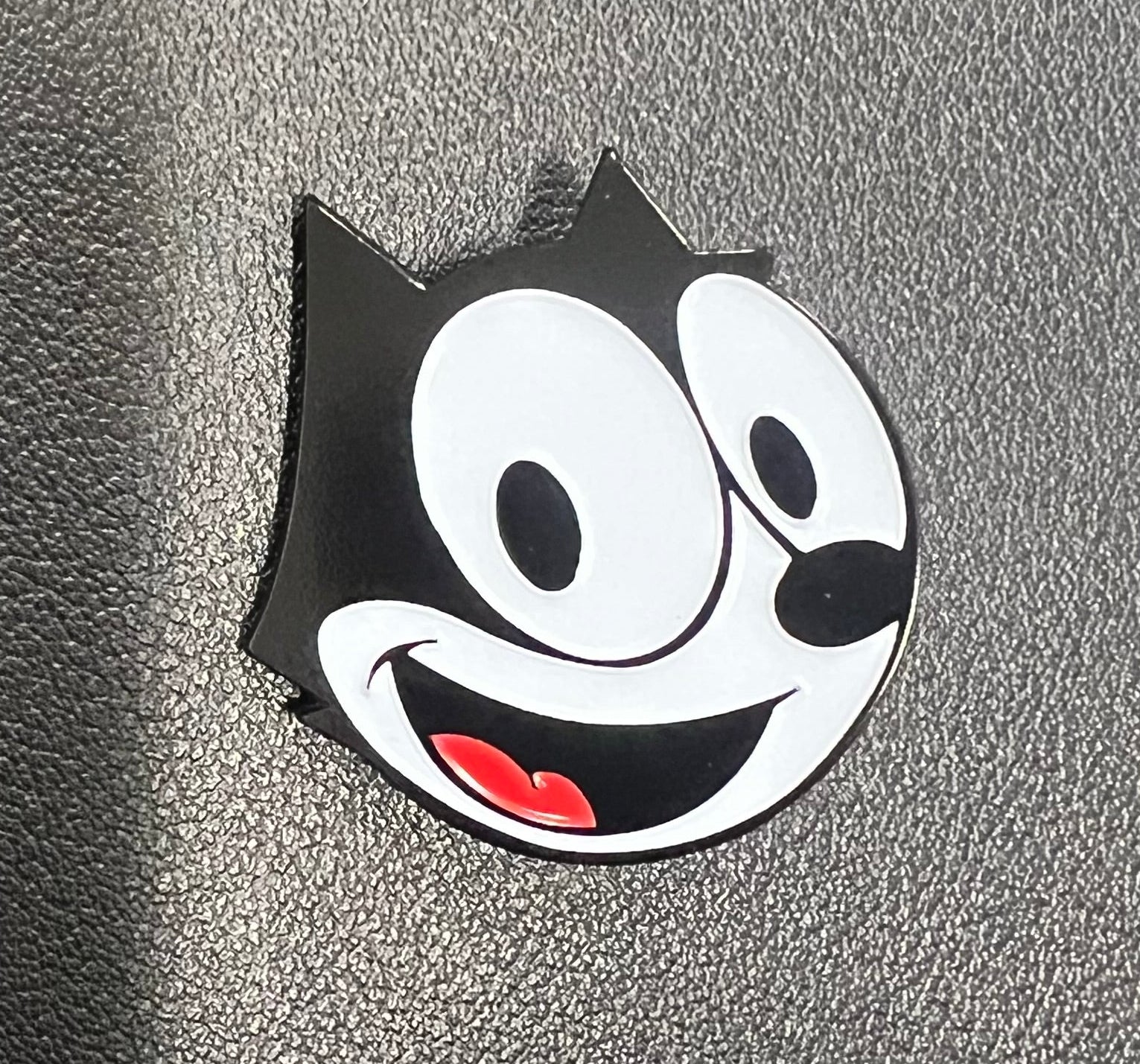 Closeup of Classic Felix collectible enamel style pin