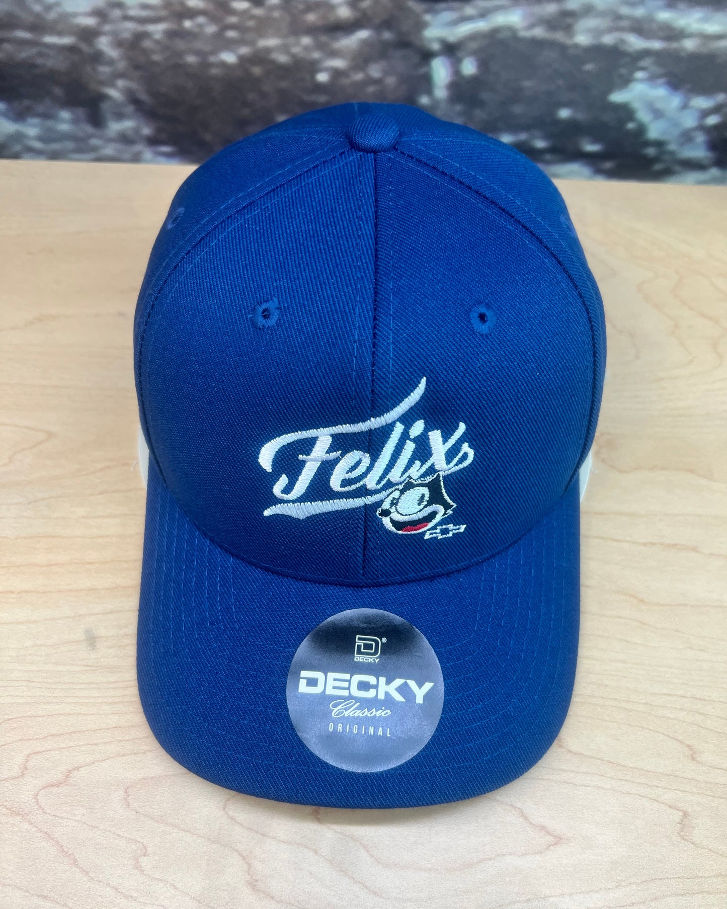 Front angle of royal blue Felix mesh trucker cap with adjustable fit