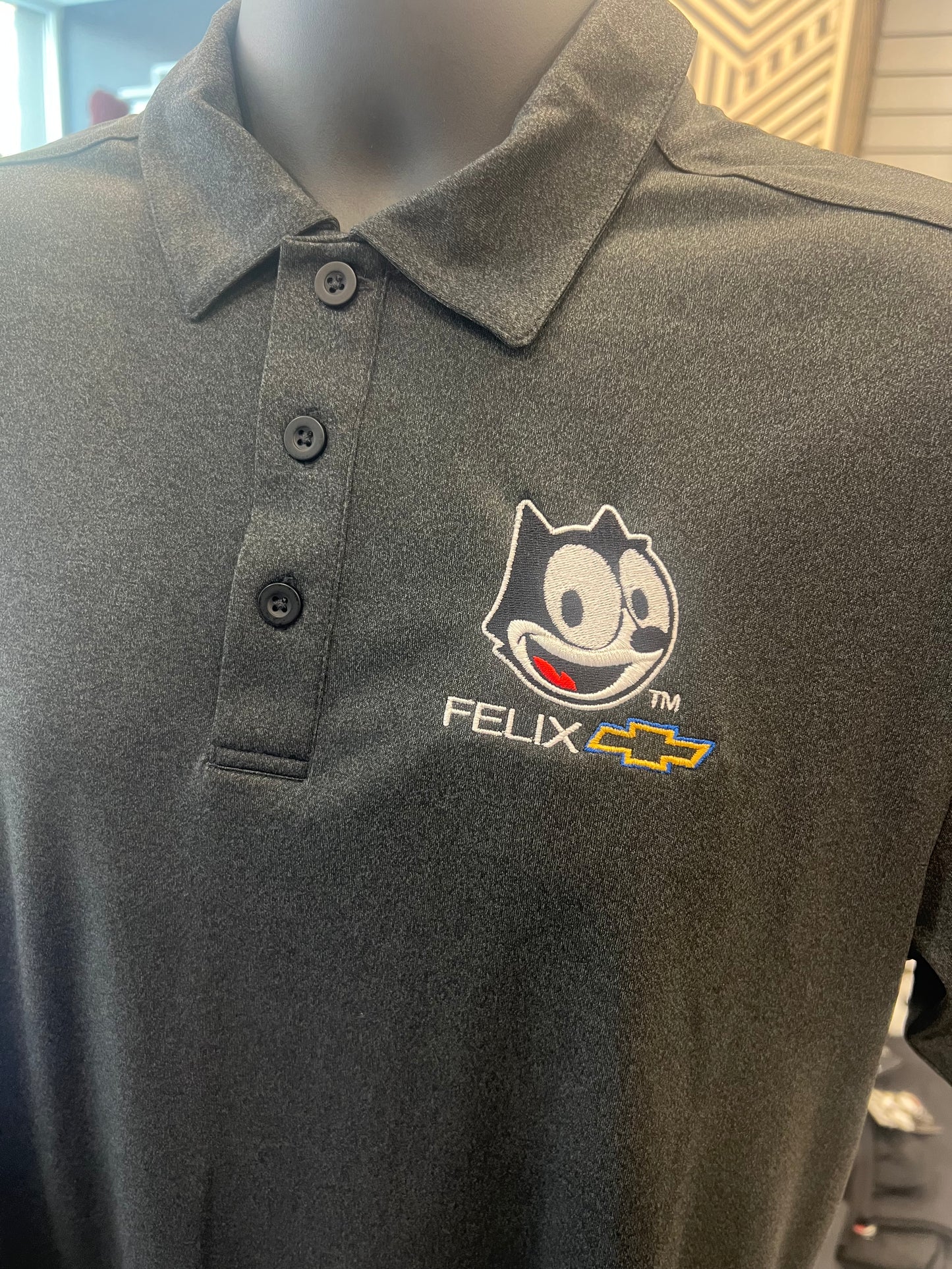 Closeup embroidery detail on Felix Boulevard Polo
