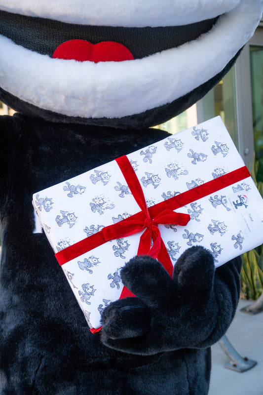 Felix Gift Wrap wrapping paper with red ribbon and Felix The Cat pattern design