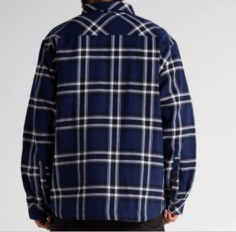 Back view of heavyweight navy plaid Felix flannel jacket with quilted lining