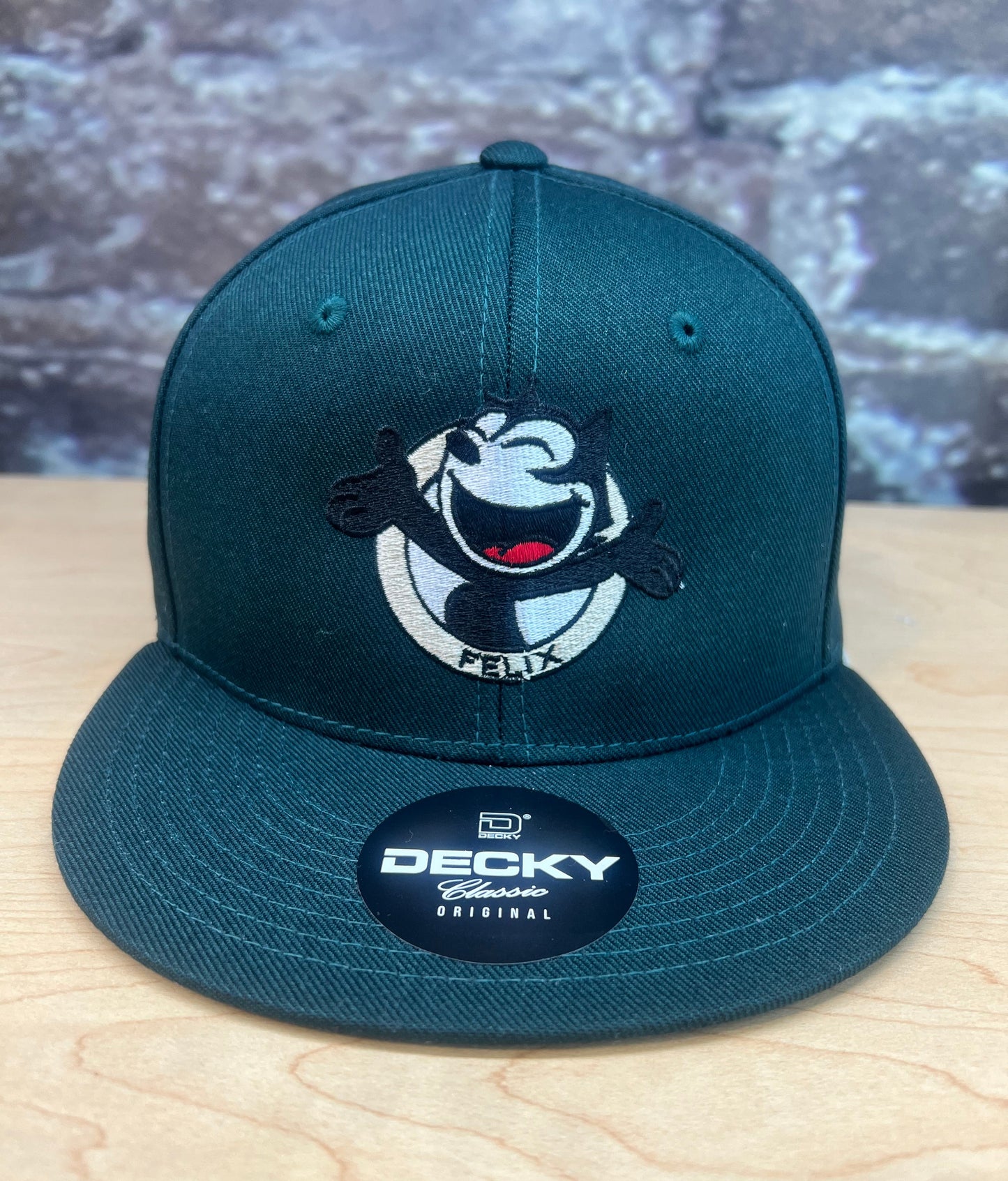 Forest green Happy Felix snapback hat with embroidered smiling Felix The Cat design